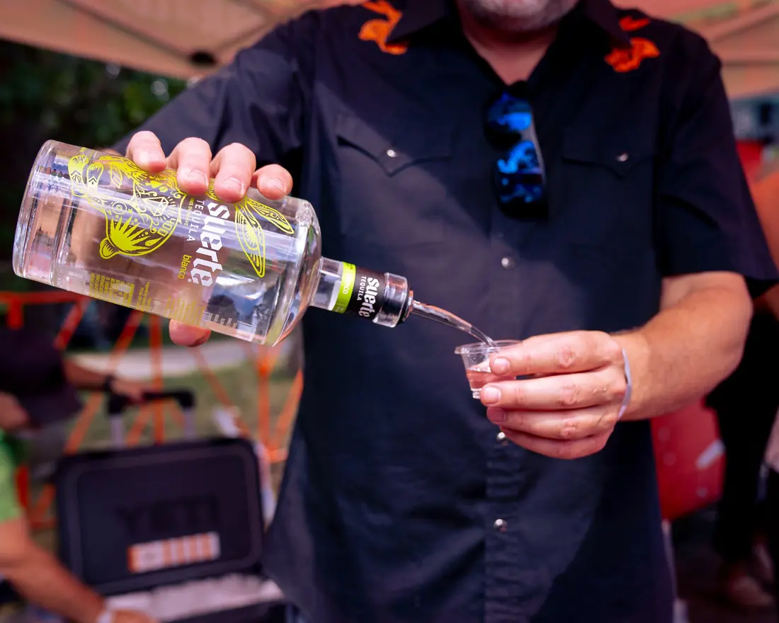 A tequila sample being poured for a guest